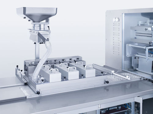 Beschicker-Dosierer / Vibration - Brush Box - Uhlmann - automatisch / für die Pharmaindustrie / Tabletten